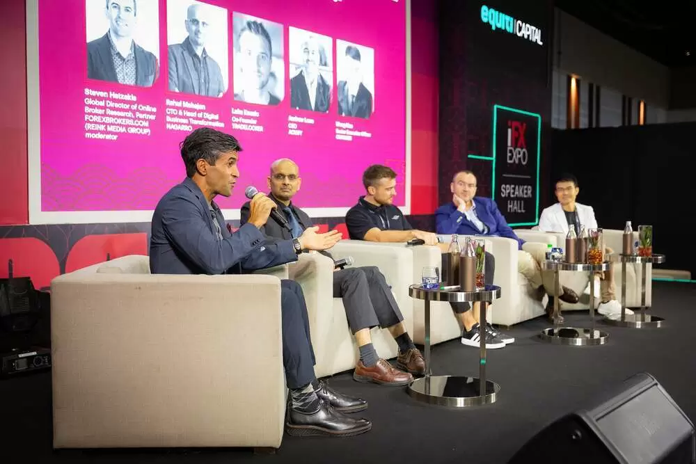 Steven Hatzakis moderating a panel at the iFX Expo in 2024.